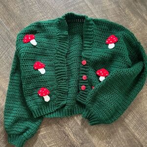 Dark green hand made mushroom cardigan. Fits a small or extra small!